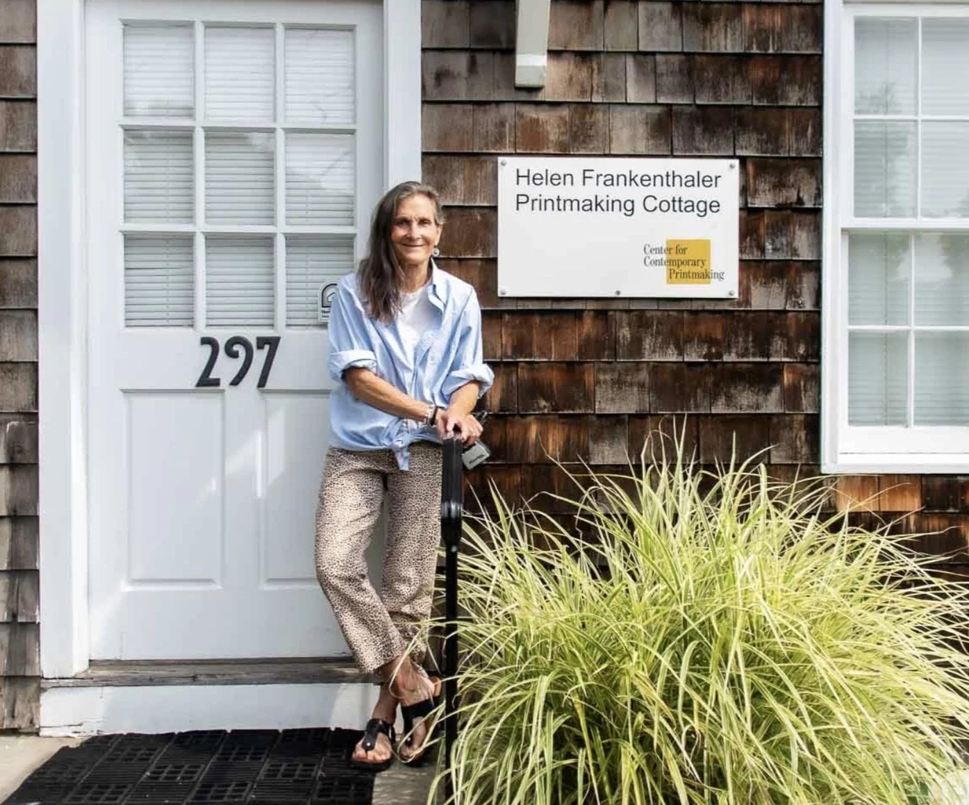 Photo of Francie Ashforth in front of the Center for Contemporary Printmaking, ‘The Cottage’, photo, Harrison Gordon 2024